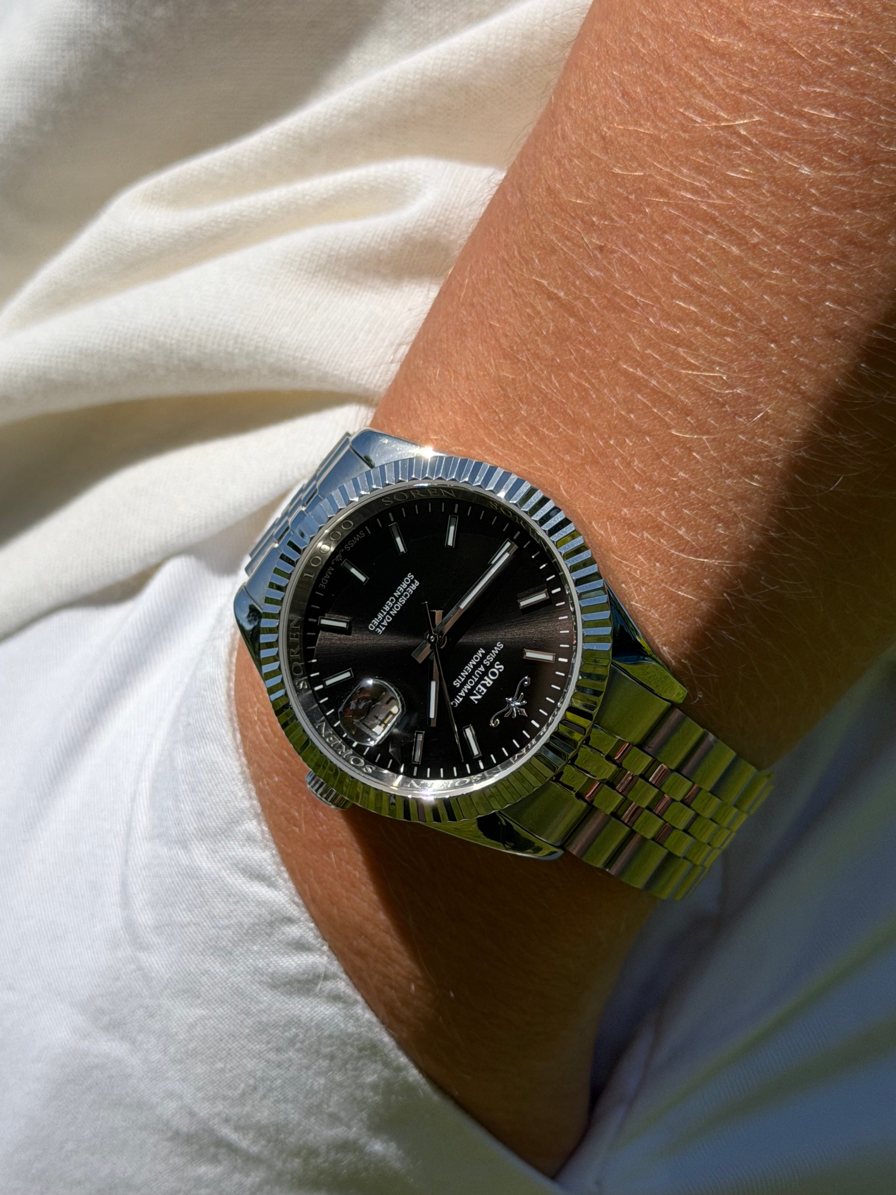 Soren Momentis Black on wrist — Swiss Made automatic, jubilee bracelet
