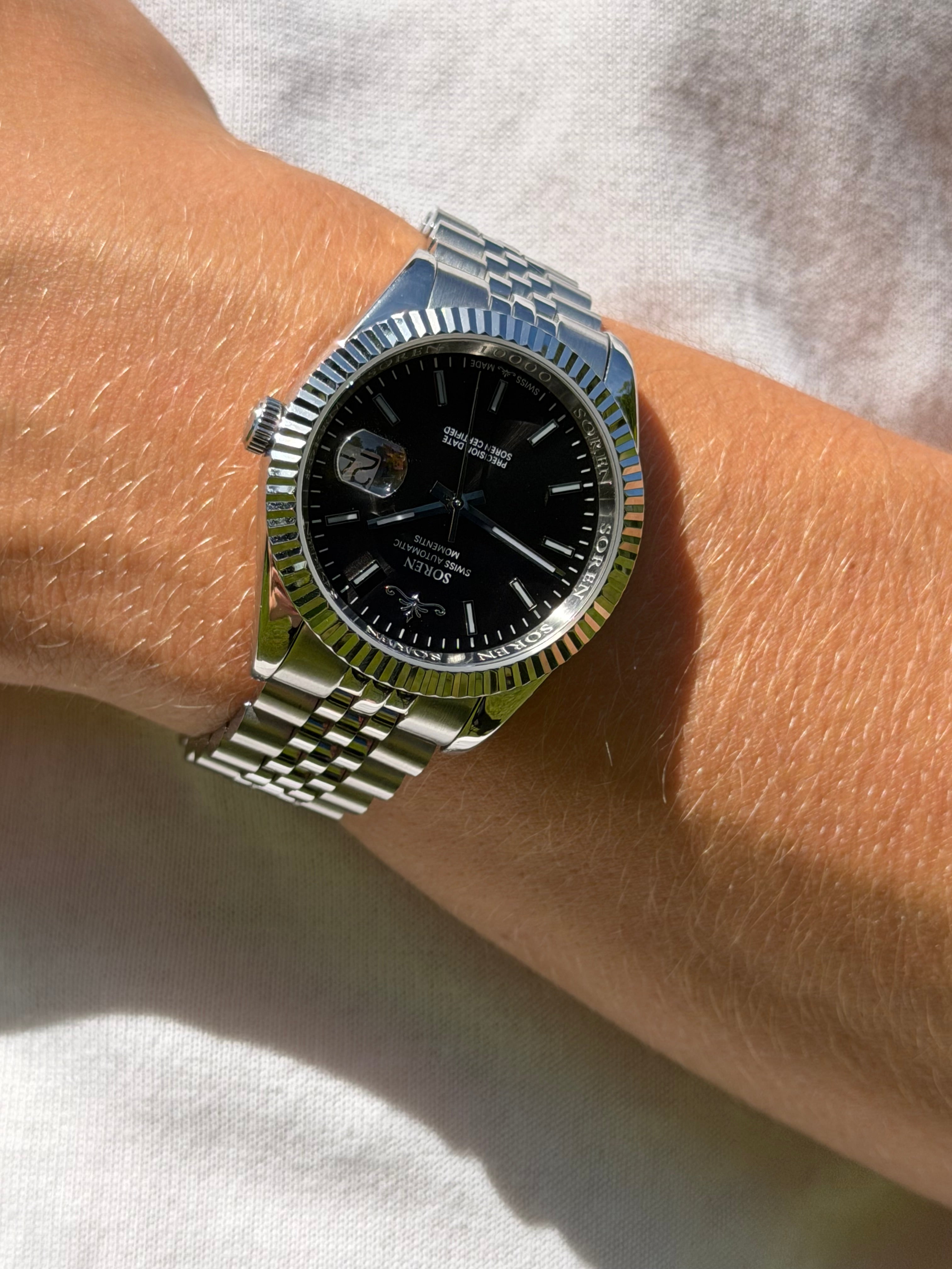 Soren Momentis Black watch worn outdoors — jubilee bracelet, 40mm case