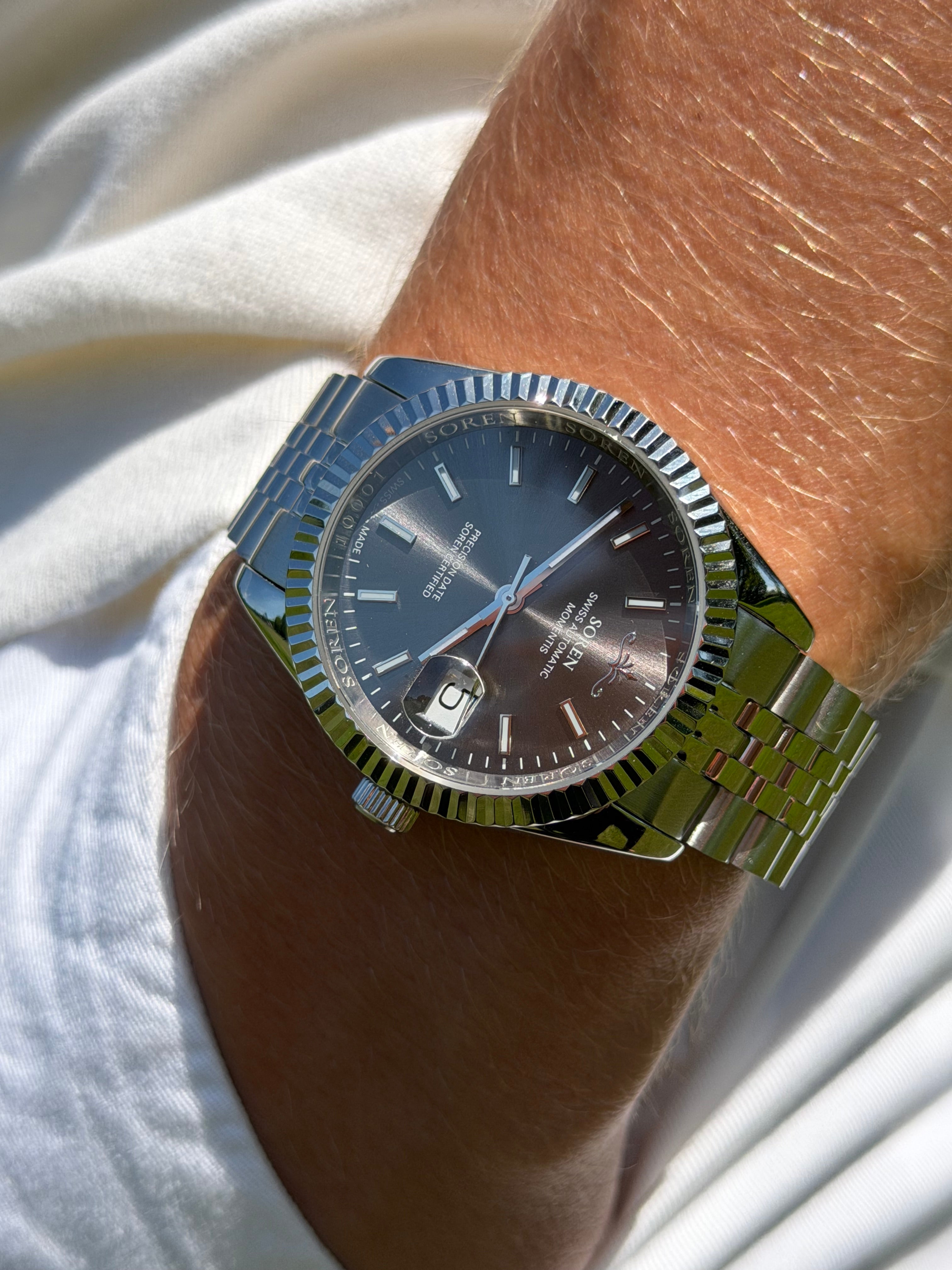 Soren Momentis Grey on wrist — Swiss Made automatic, jubilee bracelet
