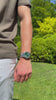 Soren Momentis Green watch worn outdoors — 40mm case, jubilee bracelet