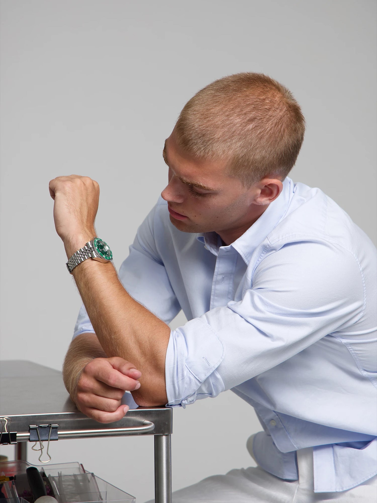 Man in a light blue shirt wearing a SOREN Oceanic green dive watch on a Jubilee bracelet
